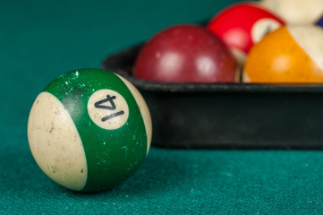 Billiards balls and cue on billiards table. Billiard sport concept