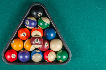 Billiards balls and cue on billiards table. Billiard sport concept
