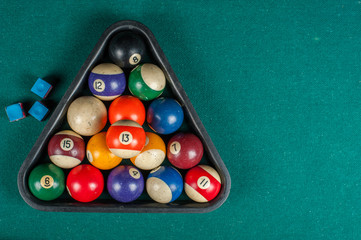 Billiards balls and cue on billiards table. Billiard sport concept