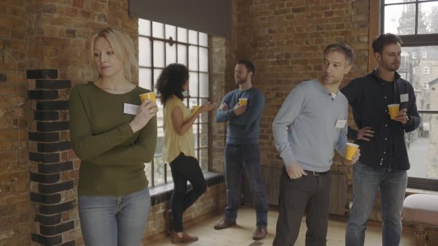 Group meeting and talking at social networking event