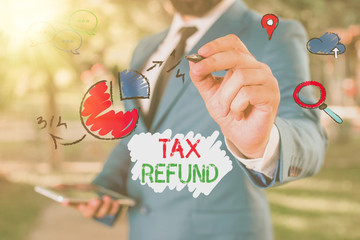 Conceptual hand writing showing Tax Refund. Concept meaning refund on tax when the tax liability is...