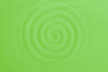 Spiral helix gyre pattern. Ceramic dish, circular vibrations. Light green rippled waves