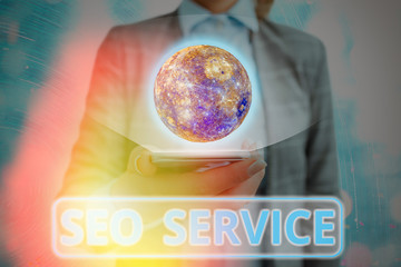 Writing note showing Seo Service. Business concept for techniques and procedures to increase the...
