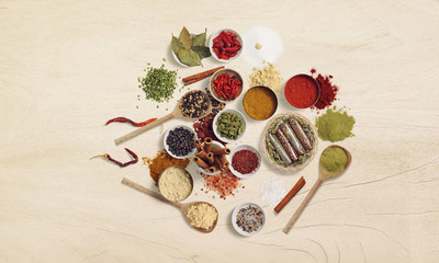 Spices and Herbs on wooden background. Food and cuisine ingredients. Pepper, salt, paprika,...