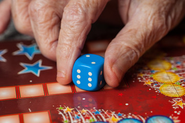 Obraz premium Colorful figures and dices of ludo family board game.