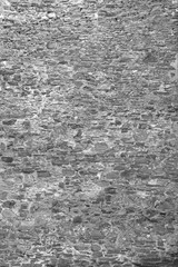Vintage narrow grayscale stone wall texture background