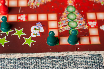 Colorful figures and dices of ludo family board game.