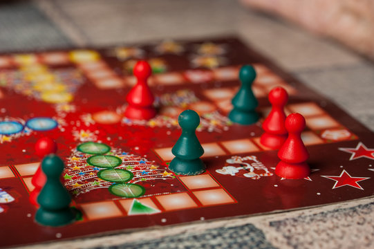 Colorful figures and dices of ludo family board game.