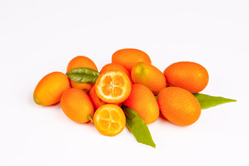 Cumquat or kumquat with leaf isolated on white background close up