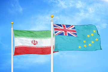 Iran and Tuvalu two flags on flagpoles and blue cloudy sky