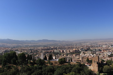 Fototapeta na wymiar Aerial view of the Albaicin city taken from Watch Tower (Torre de la Vela) of the historical Alhambra Palace complex in Granada, Andalusia, Spain.