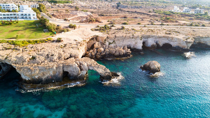 Aerial bird's eye view of Love bridge, international sculpture park and sea caves, at Cavo Greco,...