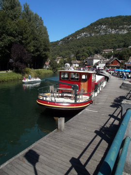 Chanaz, France - August 1st 2011 : Focus on a boat moored at the quay, waiting for tourists to visit the Savi&egrave;res canal, the Rhone (the river) and the lake of Aix-les-Bains.