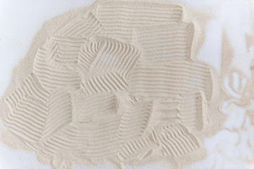 background drawing on natural sand in the sandbox