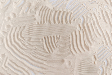 background drawing on natural sand in the sandbox