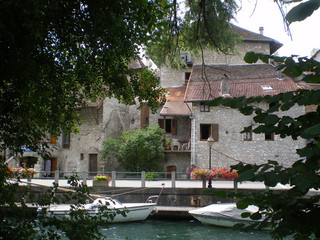 Chanaz, France - August 6th 2008 : View of the houses located along the quay of the Savières canal. This town is nicknamed "Little Venice" because of its proximity to water.