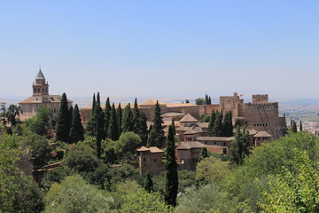 Fototapeta na wymiar Historical Alhambra palace and fortress complex taken from Generalife gardens in Granada, Andalusia, Spain.