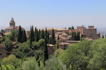 Fototapeta na wymiar Historical Alhambra palace and fortress complex taken from Generalife gardens in Granada, Andalusia, Spain.
