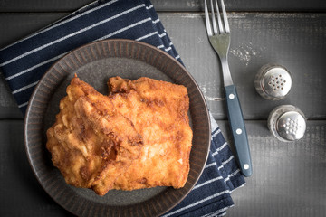 Two fried cod fillet pieces.