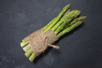 Fresh tasty green asparagus in rustic style
