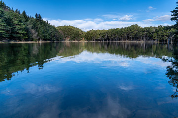 Obraz na płótnie Canvas Bassa d´Oles lake with reflection in winter.