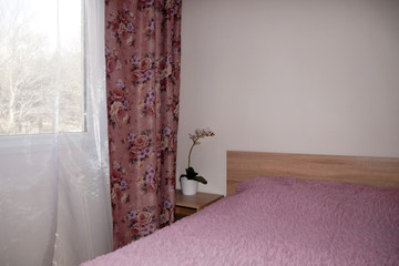 fragment of the interior of the bedroom in pink colors