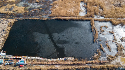 the top view of the fisher on iced lake