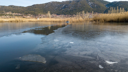 the boat and iced lake when fishing
