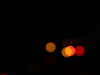 Abstract texture of colored light circles on black background. Concept: night lights