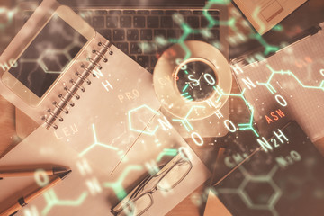 Double exposure of formula drawing over table with phone. Top view. Education concept.