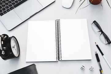 Desk with laptop, notebook, pens and pencils for work, studying and business. Working on projects.