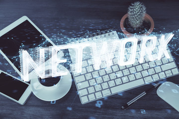 Double exposure of technology theme drawing over work table desktop. Top view. Global data analysis concept.