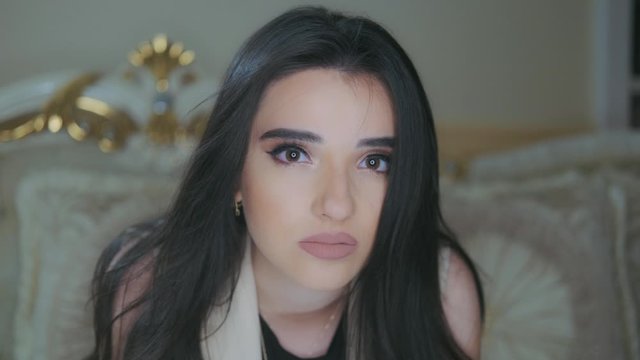 young beautiful model sad looking at camera and posing