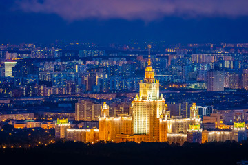 Moscow. Russia. Night panorama of Moscow. Capital aerial view. Lights of the night city. Moscow State University glows at night. Seven sisters. Russian architecture. City landscape. Cities of Russia