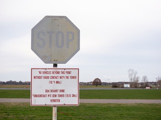 Old Stop Sign In Public City Park Tempelhofer Feld, Former Tempelhof Airport In Berlin, Germany