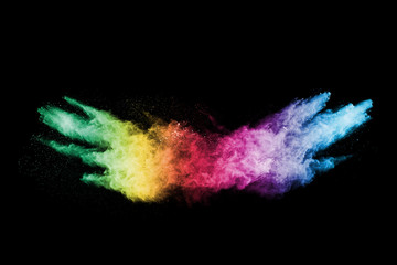 abstract colored dust explosion on a black background.abstract powder splatted background,Freeze...