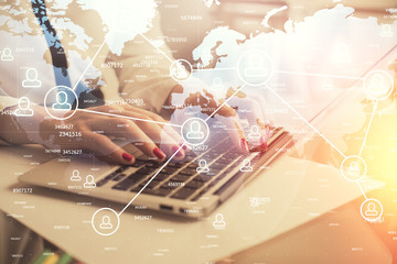 Double exposure of woman hands typing on computer and social network theme hologram drawing. People media concept.