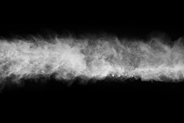 White powder explosion on black background. Colored cloud. Colorful dust explode. Paint Holi.