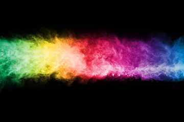 Fototapeta premium abstract colored dust explosion on a black background.abstract powder splatted background,Freeze motion of color powder exploding/throwing color powder, multicolored glitter texture.