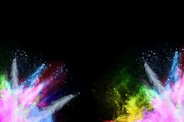 abstract colored dust explosion on a black background.abstract powder splatted background,Freeze motion of color powder exploding/throwing color powder, multicolored glitter texture.