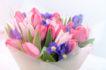 beautiful bouquet of blooming pink, yellow and white tulips. Flowers as a gift for Women's Day