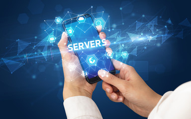 Female hand holding smartphone with SERVERS inscription, modern technology concept