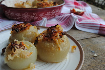 Minced Meat and Rice Stuffed Onions, served on a plate. Close up view.