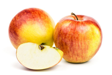 Naklejka na ściany i meble Two ripe red-yellow apples and a slice with striped pattern isolated on white background.