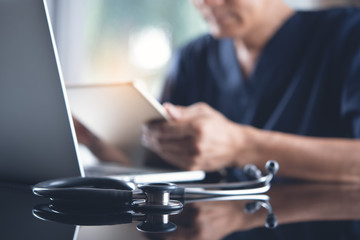 Doctor working on laptop computer