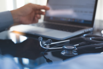 Doctor working on laptop computer