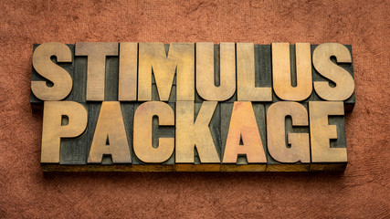 stimulus package word abstract in wood type