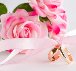 Wedding concept with rings and roses