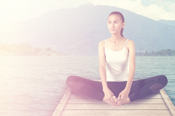Fototapeta na wymiar young woman practice yoga on the sea 