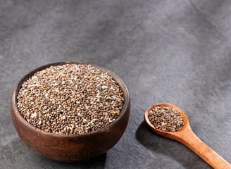 Salvia hispanica - Organic chia seeds in wooden bowl